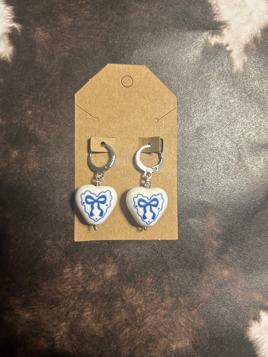 Blue bow, silver hoop earrings ￼